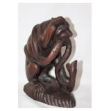 Large wooden tiger fighting a snake