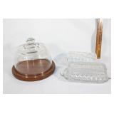 Two glass butter dishes, covered cheese board