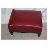 Red faux leather ottoman