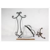 Three decorative cast iron wall hangs