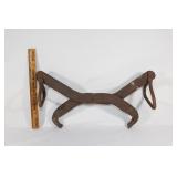 Antique metal tongs with swing handles