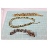 Three designer signed costume jewelry pieces