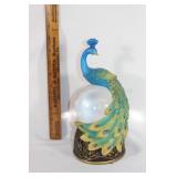Battery operated peacock snowglobe