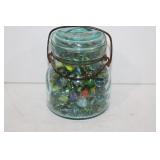 Large jar full of vintage marbles