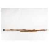 Hand carved wooden cane with metal handle