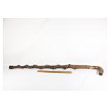 Thick wooden cane with twist and brass detail