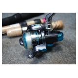 3 Ice Fishing Poles & 1 Reel