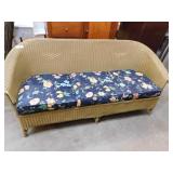 Wicker Couch, Navy Floral Cushions