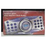 NIB Sharper Image Mini AM/FM Clock Radio