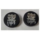 2 Cleveland Monsters Signed Hockey Pucks