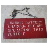 Unhook Charger Before Operating Metal Sign