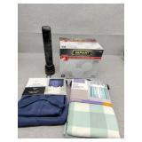 Small curtains, maglite and flood light