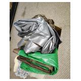 Tarps unknown size and two rugs