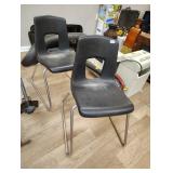 Two stackable plastic chairs