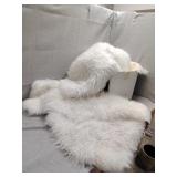 Three white rugs