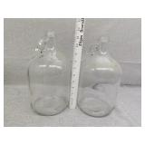Two glass cider jugs
