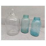 Two blue ball jars and glass cider jug