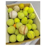 Tennis balls and a couple baseballs