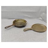 Two cast pans