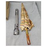 Gray maglite and umbrella