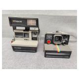 Two Polaroid cameras