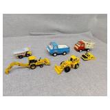Two tonka trucks and construction toys