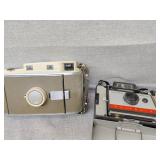 Two Polaroid cameras