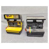 Two Polaroid cameras