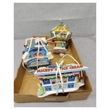 Three department 56 Mickey mouse buildings