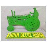 Two John Deere metal signs