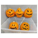Five small light up pumpkins