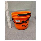 Three small Halloween buckets and pez dispenser
