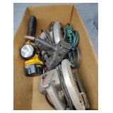 Old skill saws and DeWalt flashlight with battery