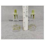 Two Pyrex salt pepper shakers