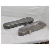 Two empty violin cases