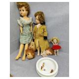 Dolls and small water bowl maybe