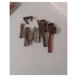 Two pipe wrenches, two vice grips 1 putty knife