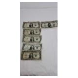 5  one dollar silver certificates and one 5