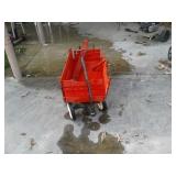 Red wagon with side rails. Needs rails repaired