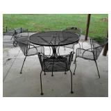 wrought iron table and 4 chairs, some rust on