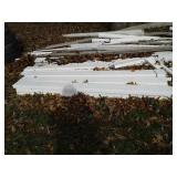 Stack of white vinyl deck material, some from