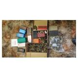 Mostly empty shell casings shotgun pistol rifle