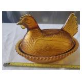 Hen on Nest.  Amber Glass