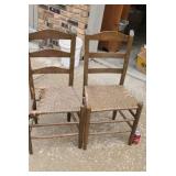 Two old cane bottom chairs one is damaged.