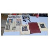 Newspaper and books and stamps on Kennedy