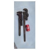 Two pipe wrenchs.