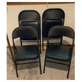 4 black folding chairs