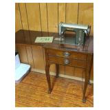 Universal cabinet sewing machine.