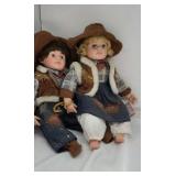 Boy and girl western vinyl dolls