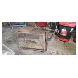Steel welding table with old black Smith leg vice